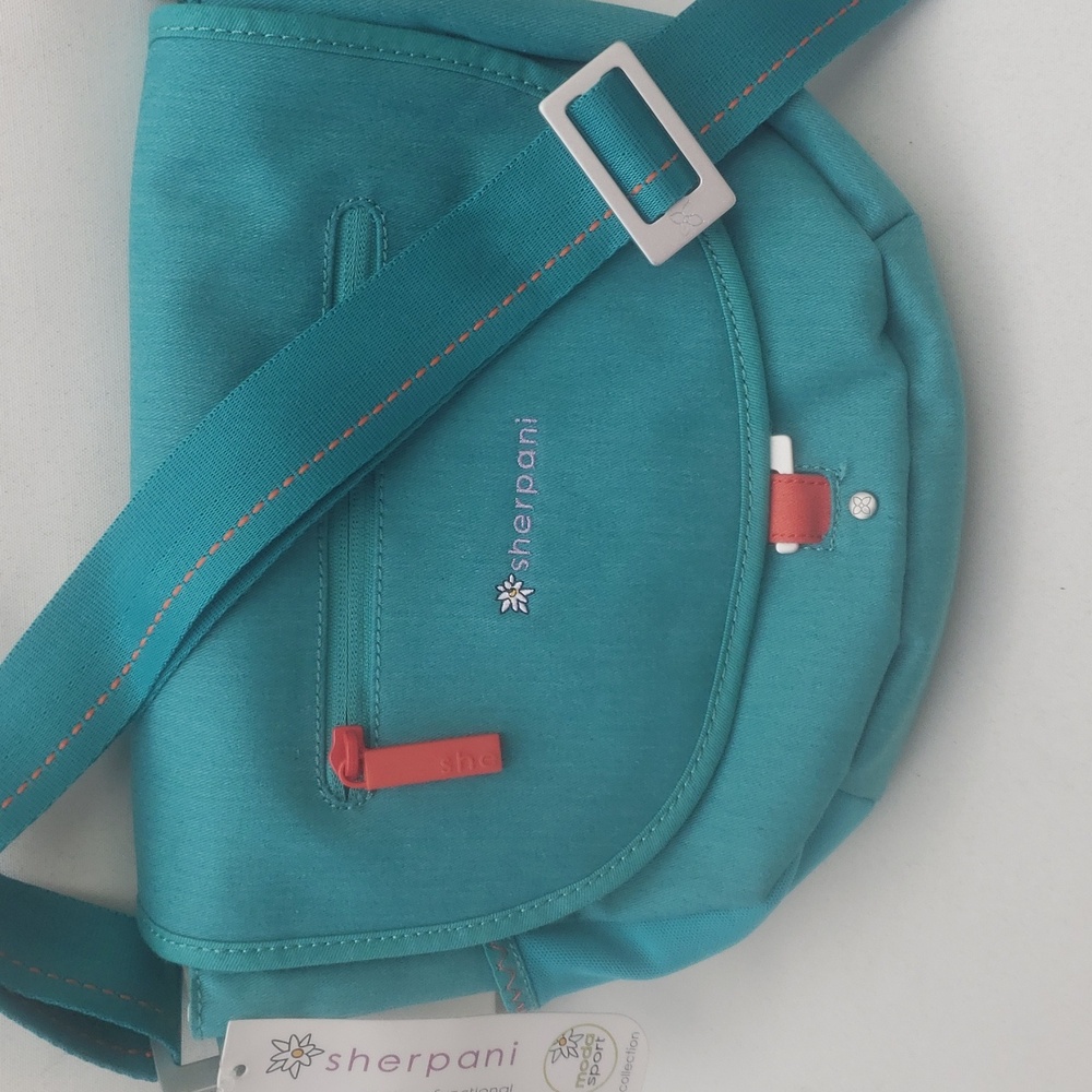 Sherpani Teal Crossbody Bag with Coral Accent